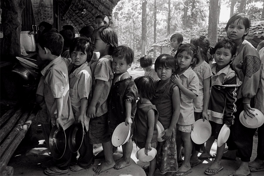 Rocky Mountain School: lineup to eat traditional mohinga (fish noodle soup.). The homemade mohinga was provided by an individual donor for Chinese New Year, as a taste-of-home treat for students who normally receive only Thai meals from donating organizations. 