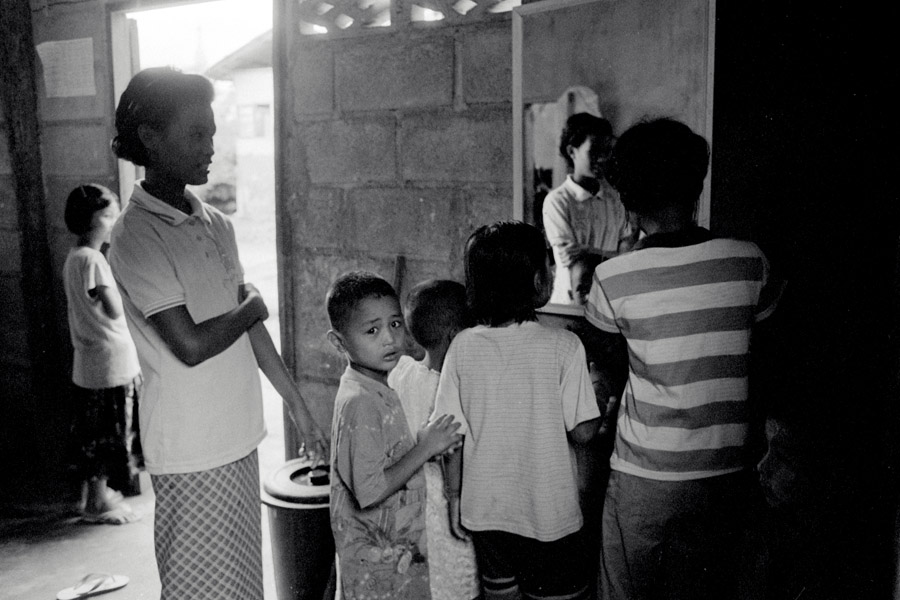 New Blood School: lining up to use the dorm mirror. 