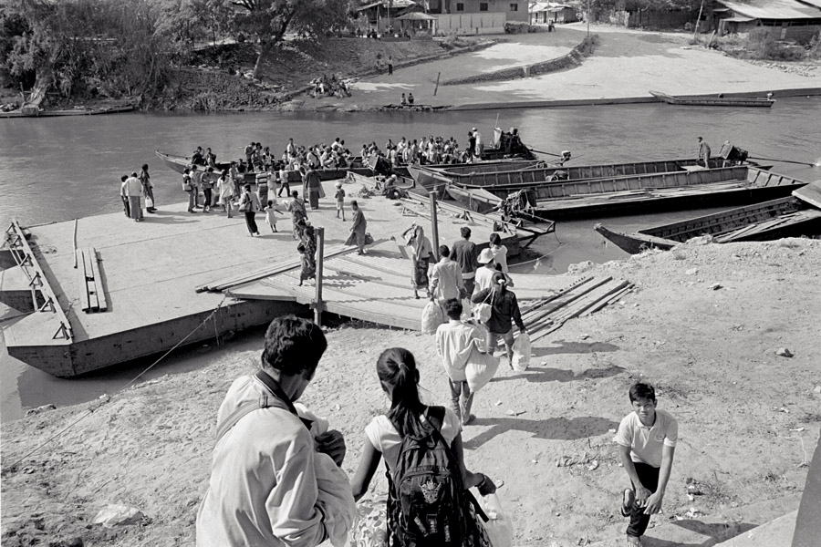 2010: On November 8th, the evening of the first democratic elections in Myanmar, fighting erupted in the villages near Myawaddy, and a bomb exploded in the border market on the Thai side of the river. Refugees poured in Thailand and were lodged at the army base on the highway. <br><br>They were officially sent back after 3 days to avoid government conflict. Not everyone felt safe to return and hid in Mae Sot. Those who returned were helped by various NGOs like Help Without Frontiers, who arranged transportation and provided food (in addition to support from the Thai army). The river is crossed by long motorized boats for a small fee. This is also how migrants enter illegally under normal circumstance.