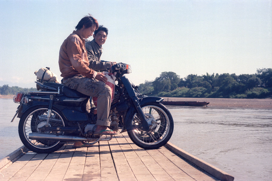 Khamti, Sagaing Division 2014: ferries for taking motorbikes across the river from Khamti to Sandhi are a motorized combination of raft and canoe.
