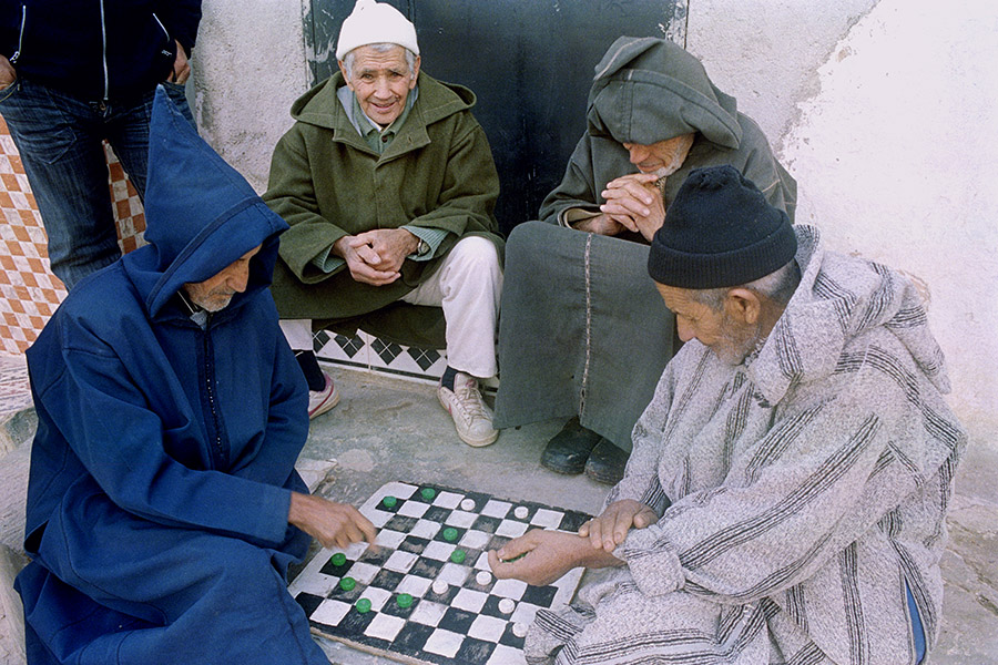 Bhalil, Morocco 2016: men wearing traditional djellabas to protect against the cold.