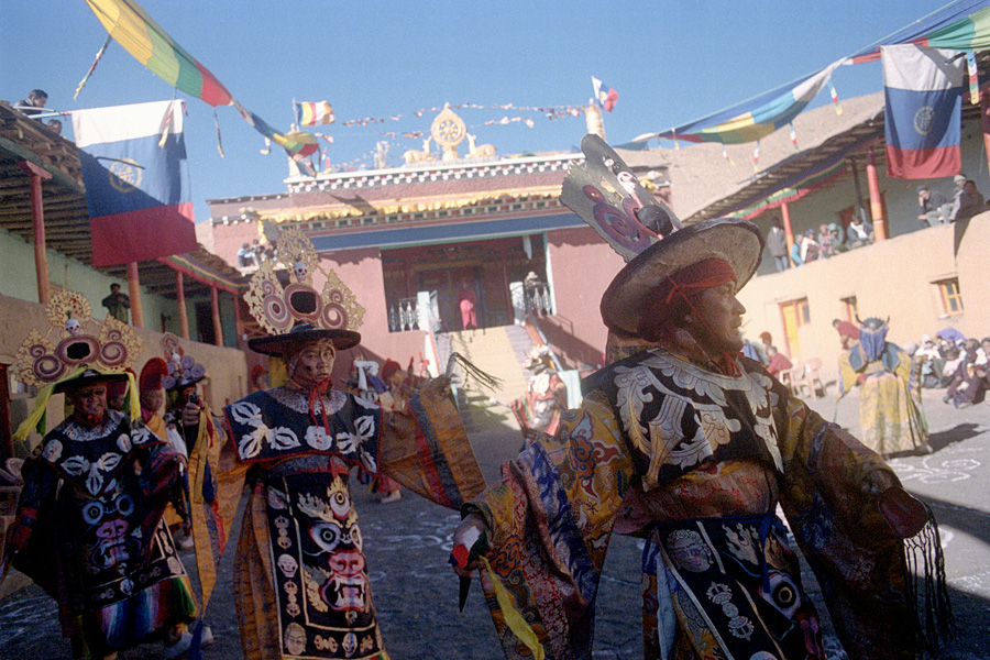 Khomic village, Spiti Valley, India 2014: Traditional cham dance performed by Tibetan Buddhist monks to bring blessings onto the community, featuring brightly-colored costumes and masks.