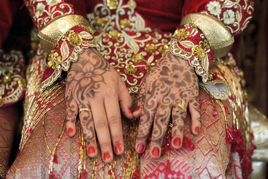 Harau, Sumatra, Indonesia 2013: the bride's hennaed hands at a Minangkabau wedding.