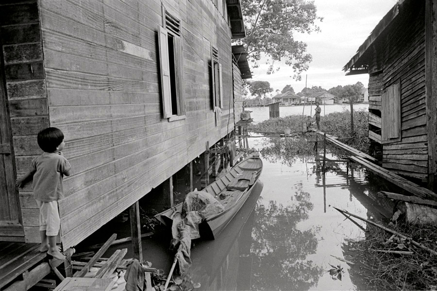 Muara Muntai, Kalimantan, Indonesia 2010: a village built of boardwalks over muddy water.