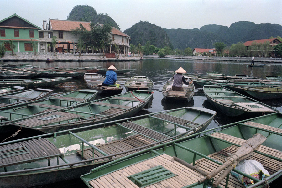 Tam Coc, Vietnam 2013: tourist boats piling up at the embarcardero.