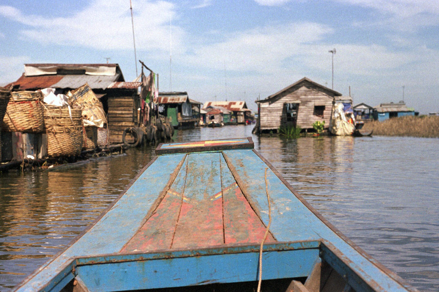 Kompong Luong, Cambodia 2012: houses near the edge of the village are on stilts, while those further in float and towed toward Tonle Sap's center during dry season. Boats are required for getting around.
